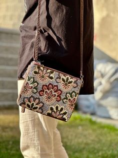 Hand embroidered floral sling bag that will add an oomph to your outfit. Chic Multicolor Embroidered Bag, Spring Embellished Bags For Everyday Use, Spring Embellished Bags For Everyday, Chic Embroidered Crossbody Bags, Multicolor Embroidery Crossbody Shoulder Bag, Spring Embellished Rectangular Bag, Spring Embellished Shoulder Bag, Embellished Rectangular Shoulder Bag For Everyday Use, Everyday Embellished Rectangular Shoulder Bag