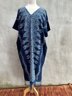 HAND WOVEN & HAND DYED INDIGO KAFTAN MINI DRESS MEASUREMENTS:  * One Size Fits  * Best for US size: Small to Medium  * Arms      22 inches round * Bust / Waist / Hips Circumference 56 inches * V-Neck      * Length    44 inches  * Material   100% Cotton, Natural Indigo dye M O D E L: * Size US 4  * Height 5 feet 4 inches or 163 cm.  Every kaftan is unique and hand woven on a traditional loom.   The 100% cotton is hand dyed natural indigo, other natural colors, or natural cotton color. You will fe Indigo Bohemian Dress For Festival, Indigo Bohemian Festival Dress, Indigo Cotton Dresses With Natural Dye, Indigo Cotton Dress With Natural Dye, Blue Summer Dress With Natural Dye, Indigo Batik Print Summer Dress, Summer Indigo Batik Print Dress, Indigo Bohemian Beach Dresses, Traditional Blue Dress With Kimono Sleeves