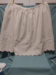 Channel your inner cottagecore fairy in this lovely little cotton number. In excellent condition with no rips, tears, or stains, this gorgeous skirt is too pretty to be forgotten. The tag is illegible, but the zipper action is smooth and easy. No size is indicated but this skirt measures 17 inches across at the waist. Snap this up before it's gone! This item is sold "as is" and as pictured. Eyelet Skirt, Cottagecore Vintage, Cottagecore Fairy, White Vintage, Halloween Shopping, Paisley, Art Collection, Womens Skirt, Bathing Beauties