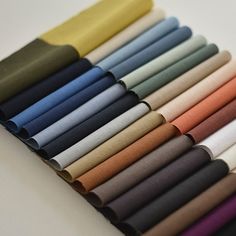 many colors of fabric are lined up together