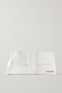 This version of Jacquemus' 'Le Bambino' bag is made from white leather in a 'Long' yet compact silhouette with sharp angles. It's designed with gold hardware, including the logo plaque at the front, and has a canvas interior with a single card slot. The slim strap fits comfortably over the shoulder or in the crook of your arm. Jacquemus Le Bambino Long, Jacquemus Bag, Brown Bags, Metallic Logo, Signature Logo, Mr Porter, Designer Bags, White Bag, Leather Tote Bag