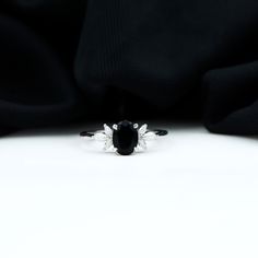 Product Details Surprise her with a Vintage Floral Ring, featuring a Black Onyx gemstone accentuated with Diamond stones. This stunning Black Onyx Engagement Ring will bring a smile to her face and make her feel extra special. Product Information SKU SHP-RINGS0821187872 Width 4.2 mm Height 8 mm Weight 1.70 gm (Approximate) BLACK ONYX INFORMATION No.of Stones 1 Pieces Total Weight 1.10 Carat (Approximate) Dimension(approx) Oval-6X8 mm-1 Pcs Color Black Cut Brilliant Shape Oval Setting Type Claw-Set Quality Grade AAA DIAMOND INFORMATION No.of Stones 6 Pieces Total Weight 0.40 Carat (Approximate) Dimension(approx) Marquise-1.50X3.00 mm-4 PcsMarquise-2X4 mm-2 Pcs Color HI Cut Brilliant Shape Marquise Setting Type Claw-Set Quality Grade SI View More Product Parent Collection Handle black-onyx-e Gold Floral Engagement Ring, Engagement Ring Black, Black Onyx Engagement Ring, Oval Setting, Onyx Engagement Ring, Floral Engagement Ring, Floral Ring, Ring With Diamond, Signature Jewelry