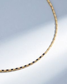 Crafted from 18-karat gold, this sapphire tennis necklace represents Suzanne's contemporary take on the classic design. Its flexible and fluid structure is adorned with 2.60 carats of black sapphires baguettes, elegantly aligned to encircle the neck with a seamless stream of sparkle. Details 18k yellow gold 2.60 carats of black sapphire baguettes Necklace measures 16" inches in length Box clasp with safety lock fastening 1.75mm width Ref: BAP695BK Elegant Black Box Chain Necklace, Black Jewelry With Rectangular Box Chain Links, Elegant Black Jewelry With Rectangular Links, Sapphire Tennis Necklace, Baguette Necklace, Black Sapphire, Color Crafts, Box Clasp, Tennis Necklace