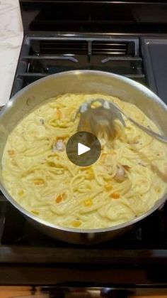 a pan filled with food sitting on top of a stove