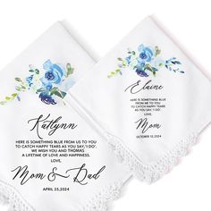 two white handkerchiefs with blue flowers on them and the names of their wedding guests