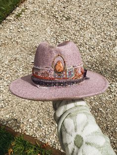 "Handmade Wool Hat  Color: Dusty Purple  Made with recycled materials and handmade elements. Sunstone set in brass, inspired by the red rocks sits at the top of the crown while a string of Moonstone adorns the side.  Check out my stories/millinery highlight on my Instagram for a more in depth chat about this hat! @whileautumnsleeps Hat Circumference: 57-59cm/22.4\"-23.22\" Brim Width: 7cm/2.75\" Height: 12cm/4.72\" Hat care: - each hat has a silk liner that is lightly glued around the inside rim Bohemian Adjustable Hat Bands For Parties, Bohemian Adjustable Hat Bands For Party, Handmade Adjustable Hat With Round Crown, Adjustable Bohemian Hat Bands For Party, Pink Bohemian Hat For Gifts, Unique Adjustable Hat For Festivals, Handmade Adjustable Round Crown Hat, Handmade Artisan Hat Bands As Gift, Red Bohemian Hat As A Gift