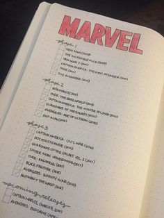 an open notebook with writing on it and the words'marvel'written in red