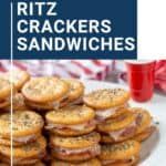 a pile of crackers sitting on top of a white plate next to a red cup