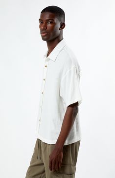 Whether you wear it for a special occasion or throw it on for a day at the skatepark, the Cream Boxy Button Down Shirt from PacSun is fashion-forward and can easily pair with the sick pieces in your closet. This button-down features a collared neckline, short sleeves, soft fabric, and a flattering fit. 


	Relaxed fit
	Short sleeves
	Collared neckline
	Button-down front closure
	PacSun branding
	100% Cotton
	Machine washable
	Model is wearing a size medium
	Model Measurements: 6'1”  Height, 34.5” Chest, 29" Waist White Relaxed Fit Casual Camp Shirt, White Camp Shirt With Button Closure And Relaxed Fit, White Relaxed Fit Camp Shirt With Button Closure, Cream Relaxed Fit Shirt With Buttons, Relaxed Fit Cream Shirt With Buttons, White Casual Shirt With Camp Collar, Classic Summer Tops For Streetwear, Cream Relaxed Fit Button-up Shirt, White Button-up Camp Shirt