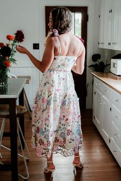 The Waverly Floral Embroidered Midi Dress is truly unique with its luxe all-over floral embroidery. This calf length dress features a faux wrap style top with adjustable spaghetti straps and hidden zipper back. Its classic a-line silhouette with a fitted bodice and full skirt gives it an extra feminine flair. A-line Dresses With Adjustable Straps For Brunch, A-line Brunch Dresses With Adjustable Straps, Feminine Floral Embroidered Maxi Dress For Garden Party, Feminine Maxi Dress With Floral Embroidery For Garden Party, Feminine Midi Floral Embroidered Dress, Feminine Midi Floral Dress With Embroidery, Floral Embroidery Midi Dress For Garden Party, Floral Embroidered Midi Dress For Brunch, Spring Floral Embroidered A-line Maxi Dress