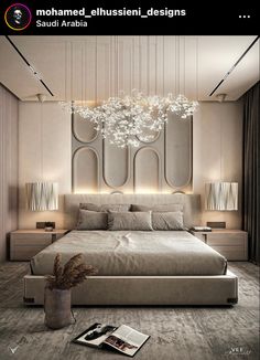 a large bed sitting under a chandelier in a bedroom