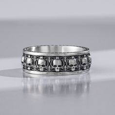 Whether you're looking for a promise ring, biker ring, or something different and unique this Skull Wedding Band Ring In Silver may be just the thing. With an antique style oxidized finish to the design and smooth finish to the inside this ring is great if you're looking for a gothic looking ring for men. It's made from sterling silver. This ring is made from sterling silver and will become one of your favorite rings in no time! It's also ideal for people who love to draw attention to themselves Punk Stainless Steel Rings For Halloween, Vintage Black Rings For Halloween, Skull Halloween Promise Ring, Gothic Stainless Steel Promise Ring, Vintage Sterling Silver Rings For Halloween, Vintage Sterling Silver Ring For Halloween, Vintage Halloween Rings As Gifts, Romantic Skeletons, Boyfriend Promise Ring