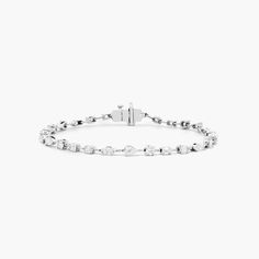 14K White Gold Petite Mix Shapes Lab-Created Diamond Tennis Bracelet. A beautiful take on a classic piece, this tennis bracelet features a row of petite mix shaped diamonds. This glamorous piece looks good on everyone and will fit perfectly into any accessories collection. Classic White Tennis Bracelet With Baguette Diamonds, Modern White Jubilee Tennis Bracelet, Classic White Baguette Cut Diamond Bracelet, White Gold Bracelet Women, Wedding Day Jewelry, Bracelet Diamond, Diamond Tennis Bracelet, Tennis Bracelet Diamond, Accessories Collection