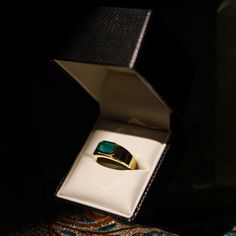 A rare 2 ct Emerald-Cut Mens Pinky Ring. Emerald Sourced from Panjshir, Afghanistan, this design embodies a timeless heirloom. Meticulously set in 18K yellow gold, it stands as a heritage piece. Luxury Yellow Gold Opal Ring, Formal Fine Jewelry Emerald Ring With Polished Finish, Formal Emerald Ring With Polished Finish, Luxury 14k Gold Opal Ring, Timeless Emerald Ring With 17 Jewels For Formal Occasions, Luxury Gold Opal Ring, Ceremonial Yellow Gold Emerald Heirloom Ring, Ceremonial Heirloom Yellow Gold Emerald Ring, Luxury Emerald Rings Hallmarked