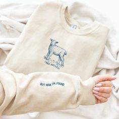 I Once was Lost but Now I'm Found Sweatshirt, Sheep Bible Verse Sleeve Print Shirt, Christian Crewneck, He Left the 99 to Rescue Me Shirt If you are looking for a subtle Christian gift for a believer or for yourself this crewneck is perfect for you! It is made from a durable and soft blend of cotton and polyester, ensuring longevity and comfort. Thank you for taking a chance on my small business! ♦ Dark design on Ash, Sand, Light Blue, Light Pink, and White. All other colors have a light design. Bible T Shirt Design, T Shirt Design Bible Verse, Left The 99 For The 1, Cool Christian Tshirts, Christian Crewneck Sweatshirt, Christian Shirt Design Ideas, Christian Merch Aesthetic, Christian Sweatshirt Designs, Christian Small Business