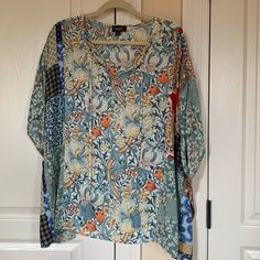 New Never Worn Poncho Style Top. Has Blue Tassel Ties In The Front. 24” Long. Hangs Lower On The Sides. 36” Pit To Pit. Nice Soft Fabric. Blue Tunic Tops For Fall, Casual Multicolor Tie Neck Tops, Blue Floral Print Tunic Top, Blue Relaxed Fit Tunic Blouse, Casual Blue Floral Print Tunic, Patterned One Size Tops For Spring, One Size Long Sleeve Tops With Floral Print, Blue Floral Print Long Sleeve Tunic, One Size Floral Print V-neck Top