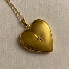 This Is Like New From Macys. A Solitary Diamond Accent Brings The Right Amount Of Sparkle To This Elegant Heart Locket Pendant Necklace Set In 10k Gold To Spring Ring Clasp. Diamond Star On One Side, Ribbed Texture On The Other. Approximate Length: 18". Approximate Drop: 1". Retails For $650, Asking $500. Dreamy Jewelry, Gold Heart Locket, Macys Jewelry, Gold Heart Pendant, Locket Pendant Necklace, Heart Locket Necklace, Heart Pendant Gold, Diamond Star, Ribbed Texture