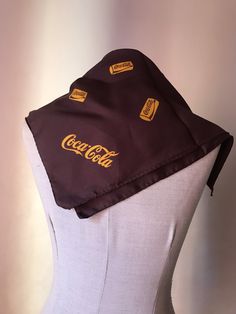 "Super rare advertising brown/orange Coca Cola squared neck scarf, featuring the classic logo and orange can prints. I guess that you have never seen a chocolate brown scarf from the Coke company before and that you have never heard that there were a scarf made by the well-known Italian (more specifically from Como lake) scarf factory of Gentilucci Really, how cool is that? There is also the small golden embossed date clamp label of the Italian designer that certifies it! The date of production Vintage Square Scarf Gift, Vintage Square Scarves For Gift, Vintage Square Scarves As Gifts, Vintage Square Scarves As Gift, Vintage Rectangular Scarves For Gift, Vintage Scarves As Gift, Como Lake, Brown Scarf, Brown Scarves