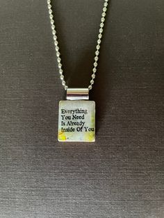 a necklace with a quote on it that says, everything in the world is already inside of you