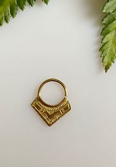 "African edgy piercing septum ring is inspired by the tribal Tuareg jewelry. The ethnic triangle nose ring will add statement detail to your boho outfit. Each piece is hand made and hand carved to offer a unique piece to adorn yourself. Material: brass Gauge 18 oooooooooo See more here : https://www.etsy.com/shop/Saajie oooooooooo ✩ WRAPPING ✩ Gift- Ready !! ✩ Your septum ring will come in a beautiful handmade cotton and recycled silk from Indian Saree pouch. Ideal for gifts or just storing your Ethnic Nose, Triangle Nose, Tuareg Jewelry, Septum Hoop, Piercing Septum, Boho Outfit, Indie Jewelry, Septum Jewelry, Sterling Silver Bangle Bracelets