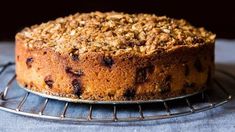 a cake sitting on top of a cooling rack