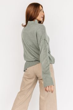 Gorgeous sage color Textured sweater knit material Classic pullover fit - relaxed and easy-to-wear Mock turtleneck Long sleeves with folded cuffs Ribbed at neckline, sleeve cuffs, and hem Slits at sides of sweater 35% Polyester, 25% Nylon, 20% Viscose, 15% Acrylic, 5% Angora Elisabeth is 5’9, bust size 32C, size 4 and wearing size S Cozy Oversized V-neck Sweater With Ribbed Cuffs, Cozy Long Sleeve V-neck Sweater With Ribbed Cuffs, Fall Long Sleeve V-neck Sweater With Ribbed Cuffs, Sage Sweater, Gray V-neck Sweater With Ribbed Cuffs, Textured Sweater, Sage Color, Mock Turtleneck, Knitting Materials