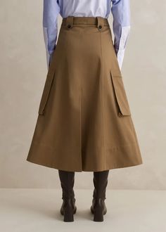 Cotton Utility Midi Skirt Tan Winter Workwear Skirt With Pockets, Workwear Midi Cargo Skirt, Winter Workwear Skirt, Cotton Cargo Skirt For Fall, Chic Workwear Cargo Midi Skirt, Fall Cargo Skirt With Pockets, Casual Cargo Skirt For Fall Workwear, Chic Knee-length Cargo Skirt For Workwear, Fall Workwear Skirt