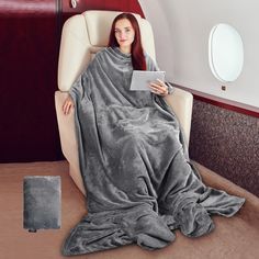 Tirrinia soft micro mink fleece 4-in-1 blanket is just the right size to wrap you in comfort while you travel. 4-in-1 blanket/pillow/lumbar support/carry case keeps you cozy, warm with polyester construction and micro mink fleece lining It easily folds within itself to a 12" x 13" carry case when folded. Turn stuff sack to front pocket with zipper for small items. The Blanket Tote unfolds easily and refolds into a convenient pillow, lumbar support, and carry case with handle. Spread it out as mu Blanket With Arms, Blanket With Sleeves, Snuggle Blanket, Oversized Blanket, Hoodie Blanket, Cozy Gift, Wearable Blanket, Fabric Squares, Soft Blankets