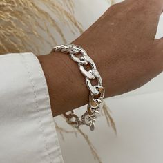 Beautiful and stylish 12mm wide shiny silver curb chain bracelet that looks awesome as well with chic or casual.   This bracelet is in quality bright silver plated stainless steel. Add approximately 3/4 - 1.5 inch to your wrist size or more if you like to wear it looser. On pictures, 6.5 inches wrist showing 7 7/8 inches bracelet. Care recommandations;  I recommand to keep the bracelet in the box when not worn, avoid water and, if possible, wipe it occasionnaly with soft dry clothe to remove cream and perfum residus  You will receive this beautiful bracelet in a box decorated with bow. Thank you for visiting! Chunky Silver Bracelet, Silver Bracelet For Women, Curb Chain Bracelet, Steel Gifts, Silver Bracelets For Women, Bracelet Argent, Bracelet For Women, Shiny Silver, Curb Chain