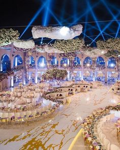 an elaborately decorated banquet hall with tables and chairs