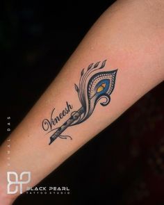 a woman's arm with a tattoo on it that reads, vineach and an arrow