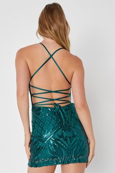 You'll stop everyone in their tracks when you arrive on the scene in the Lulus Undeniably Amazing Emerald Green Sequin Lace-Up Mini Dress! Glittering sequins create an intricate design as they dance across sheer mesh knit that shapes a notched neckline with V-bar support and a padded bodice. A figure-flaunting silhouette falls to a sexy mini hem while satin straps lace up across the open back design. Hidden back zipper/clasp. Fit: This garment fits true to size. Length: Mid-thigh. Size medium me Holiday Sequin Fabric For Homecoming, Sequin Fabric For Homecoming And Party Season, Glamorous Party Mini Dress With Lace-up Back, Holiday Homecoming Contrast Sequin Fabric, Glamorous Green Sequin Dress For Homecoming, Glamorous Green Sequin Homecoming Dress, Backless Sequin Mini Dress For Holiday Party, Party Season Sequin Dress With Strappy Back, Backless Mini Dress With Sequins For Holiday Party