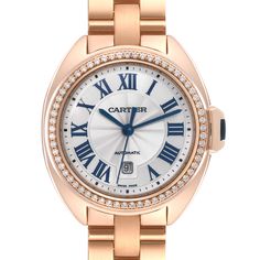 Cartier Cle Rose Gold Diamond Automatic Ladies Watch WJCL0003 Box Papers. Automatic self-winding movement. Round 18K rose gold  case 31 mm in diameter. Flush-mounted crown set with the blue sapphire cabochon. 18K rose gold original Cartier factory diamond bezel. Scratch resistant sapphire crystal. Flinque dial with a sunray guilloche pattern center and roman numerals. Blue sword shape hands. Minute markers around an inner ring. Date window at 6 o'clock. 18k rose gold bracelet with double deploya Formal Rose Gold Jewelry And Watches With Metal Dial, Rose Gold Watch With Metal Dial For Anniversary, Rose Gold Watches With Metal Dial For Anniversary, Rose Gold Watches With Round Dial For Wedding, Timeless Rose Gold Diamond Watch For Anniversary, Rose Gold Diamond Watch For Anniversary, Classic Self-winding Watch For Anniversary, Classic Self-winding Watches For Anniversary, Luxury Self-winding Round Dial Watches