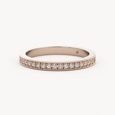 a rose gold wedding band with diamonds