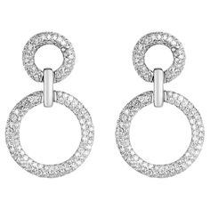 A gorgeous set of diamond drop and dangle hoop earrings. An incredibly impressive set showcasing rows of brilliant round diamonds glimmer from all angles. The earrings are lightweight and so easy to wear for an eye-catching look. Setting Style: Pave Setting Weight: 6.4 Grams Each Setting Material: 14K White Gold Main Stone: Diamond Shape: Brilliant Round Weight Total: 2.94-Carats (Total) Color: H-I Clarity: SI-I2 Luster: Excellent Treatment: Natural Double Diamond, Dangle Hoop Earrings, Gold Statement Earrings, Pave Setting, Diamond Drops, Jewelry Earrings Hoops, Pave Diamonds, Diamond Shapes, Statement Earrings