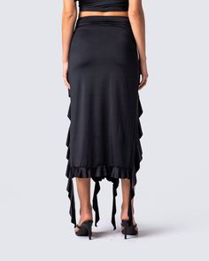 Owning an entire room has never been easier 😏 Rock your darker side with this sultry black jersey skirt. Complete with a high-waisted fit, shirring at the waist and hips, and front cutout detailing with a cascading ruffle hem 🖤 Black Stretch Elastane Maxi Skirt, Black Ruched Maxi Skirt For Summer, Chic Stretch Black Draped Skirt, High Waist Gathered Skirt Bottoms For Night Out, High Waist Gathered Skirt For Night Out, Chic Black Draped Stretch Skirt, Chic Black Hip-length Skirt, Black Stretch Draped Skirt For Night Out, Chic Black Draped Skirt With Stretch