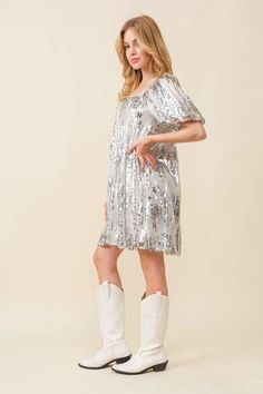 Look dazzling in this fully sequined mini dress, featuring puff sleeves for extra oomph! Let the light reflect off the sequins as you sashay your way into the night. Put some sparkle in your day - you're worth it! Spring Sequin Dress With Contrast Sequin And Short Sleeves, Spring Sequin Dress With Contrast And Short Sleeves, Glamorous Knee-length Sequin Dress For Party Season, Sequined Knee-length Mini Dress For Holiday Party, Short Sleeve Glitter Dress For Party Season, Glamorous Short Sleeve Sequin Dress With Contrast Sequins, Glamorous Knee-length Sequin Dress For Holiday Party, Glamorous Knee-length Sequin Summer Dress, Glamorous Short Sleeve Sequin Dress With Contrast