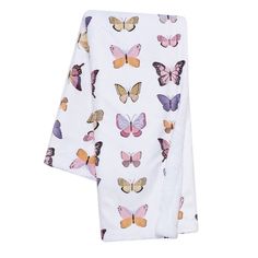 two white towels with colorful butterflies printed on the front and back, both folded up