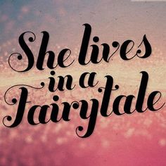 the words she lives in a fairy tale written on a blurry pink and blue background