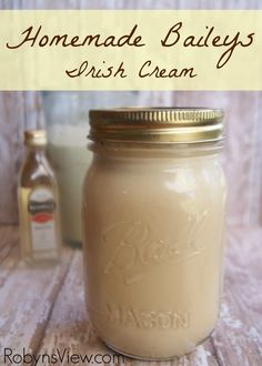 homemade bailey's irish cream in a mason jar next to a bottle of milk