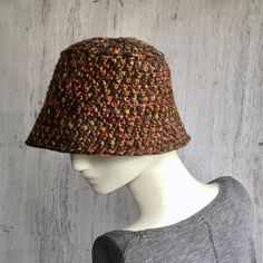 Crochet bucket hat Hat crocheted from a soft,  colorfully dyed yarn blend - 25% wool and 75% acrylic. The colors of autumn shimmer beautifully in the hat. Small brim hats can be modified in different ways.    Hat sizes: Head size 21 1/2 - 23 1/2 inches The total height of the hat is 24 cm Adjustable Crochet Hat With Short Brim For Fall, One Size Wide Brim Cloche Hat For Fall, One Size Fall Wide Brim Cloche Hat, Fall Wide Brim Cloche Hat, Fall Season Bucket Hat One Size, Curved Brim Crochet Hat For Fall, Fall Crochet Hat With Short Brim, Brimmed Multicolor Hats For Fall, Multicolor Brimmed Hats For Fall