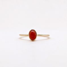 Natural Red Coral Oval Cabochon Gemstone Stackable Ring,.Semi Precious Gemstone Ring in 14k SOLID GOLD For Her from our Capsule Jewelry Collection.  Coral Stone is set in Bezel Setting in our Factory. Gold Ring AAA+ Quality. Perfect Gift For Everyday or Power Birthstone Gift for Your Loved Ones. ►  DIMENSIONS : ◆ Gemstone : Red Coral                       ◆ Stone size : 5*4 mm                           ◆ Gross Weight : 1.200 grams ◆ Shank Width : 1 mm      ◆  Material :  14k Yellow Gold      EAC Oval Ruby Ring Stackable For Formal Occasions, Elegant Oval Ruby Stackable Ring, Red Round Stone Promise Ring, Dainty Gemstone Cluster Ring, Dainty 14k Gold Cluster Ring With Gemstone, 14k Gold Rings With Bezel Setting And Oval Cabochon, Minimalist 14k Gold Jewelry With Cabochon, 14k Gold Rings With Bezel Set Oval Cabochon, Oval Stackable Ruby Ring For Anniversary