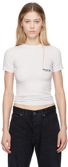 Stretch cotton jersey T-shirt. · Rib knit crewneck · Text and logo embroidered at chest Supplier color: Off white/Black White Fitted T-shirt With Embroidered Logo, Trendy Tops With Embroidered Logo, Trendy Embroidered Logo Top For Streetwear, Trendy Streetwear Tops With Embroidered Logo, Trendy Streetwear Top With Embroidered Logo, Fitted Casual Tops With Embroidered Logo, Classic Tops With Embroidered Logo For Summer, Classic Summer Tops With Embroidered Logo, Casual Fitted T-shirt With Embroidered Logo