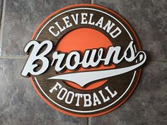 the cleveland browns football logo is shown on a tile floor in front of a wall