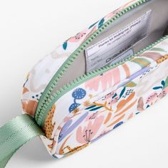 A fun pencil case that's built to handle all the thrills of a day in the wild. Big cats, blooms and a lush landscape decorate the bag's bright white exterior, and a contrasting green zipper, zipper pull and loop handle give it the perfect finish. Constructed of supremely durable polyester fabric that includes recycled plastic bottles, our roomy, easy-clean case makes it simple to keep all their pens and pencils organized and accessible. Pair with the Leopard Floral lunch box and matching backpac Pencil Case Photography, Functional White Pencil Case For Daily Use, Playful White Pencil Case For Everyday Use, Multicolor Pencil Case With Zipper For Travel, White Travel Pencil Case With Removable Pouch, White Rectangular Pencil Case For Everyday Use, Green Travel Pencil Case With Zipper Pocket, Green Pencil Case With Zipper Pocket For Travel, Green Pencil Case With Zipper For Everyday Use