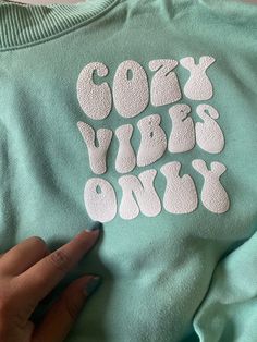 Enjoy a cozy sweatshirt that expresses how you look and how you feel. #cozyvibesonly! Cozy Super Soft Cotton Sweats, Super Soft Cozy Cotton Sweats, Cozy Crew Neck Sweats With Soft Texture, Trendy Hoodie With Ribbed Cuffs, Trendy Cozy Sweatshirt For Loungewear, Trendy Cozy Fit Sweatshirt For Loungewear, Cozy Crew Neck Sweatshirt With Soft Texture, Comfy Crew Neck Sweatshirt With Soft Texture, Trendy Cotton Sweats With Cozy Fit