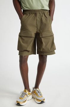 An ideal blend of function and fashion, these cargo shorts feature an elasticized waist, capacious pockets and a knee-grazing Bermuda silhouette. 10 1/2" inseam; 24" leg opening; 12" front rise; 17 1/2" back rise (size 50EU) Elastic waist Front scoop pockets; back button-welt pockets; cargo flap-patch pockets 85% polyamide, 15% elastane Hand wash, dry flat Made in Portugal Designer Clothing Cargo Bermuda Shorts, Nordstrom Store, Free Fabric, Welt Pockets, Welt Pocket, Cargo Shorts, Bermuda Shorts, Clothing Items, Givenchy