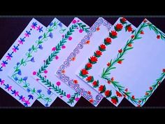 four different colored papers with flowers on them