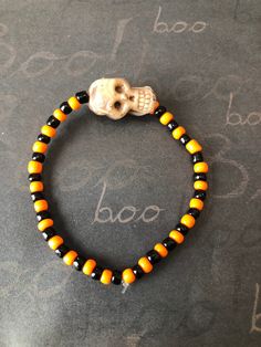 This is a Halloween Skull Beaded Bracelet. It would make a spooky addition to a Halloween costume. It would make a spooky gift for a teen or woman for Halloween. It has a large skull bead in the middle. It has orange and black seed beads. It was made with .8mm sturdy stretch string. I tie it several times to prevent breakage. It fits most teens and women. It stretches to fit on the wrist. All items are ready to be shipped I do combined shipping. Items ship in 2-3 business days. Check out more items at: http://www.etsy.com/shop/MesheleCrafts https://www.facebook.com/MesheleCrafts Halloween Black Beaded Jewelry, Novelty Black Beaded Bracelets For Halloween, Halloween Novelty Beaded Bracelets With Round Beads, Halloween Novelty Bracelet With Round Beads, Novelty Beaded Bracelets For Halloween, Adjustable Black Beaded Bracelets For Halloween, Spooky Adjustable Bracelets For Halloween, Handmade Beaded Bracelets For Halloween, Orange Beaded Bracelets For Halloween