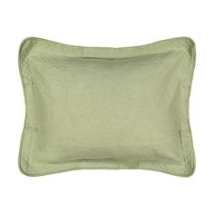 a green pillow on a white background